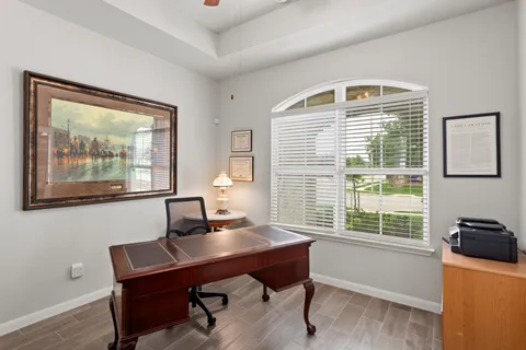 a workspace with furniture and a window