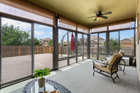 a living room with furniture and windows