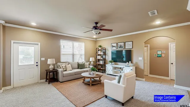 a living room with furniture and a flat screen tv