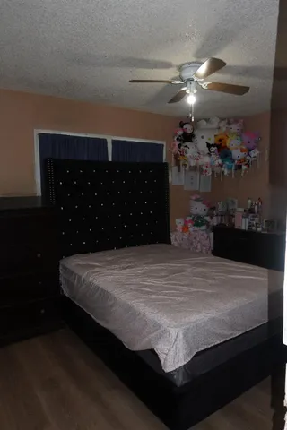a bed sitting in a bedroom and kitchen chandelier