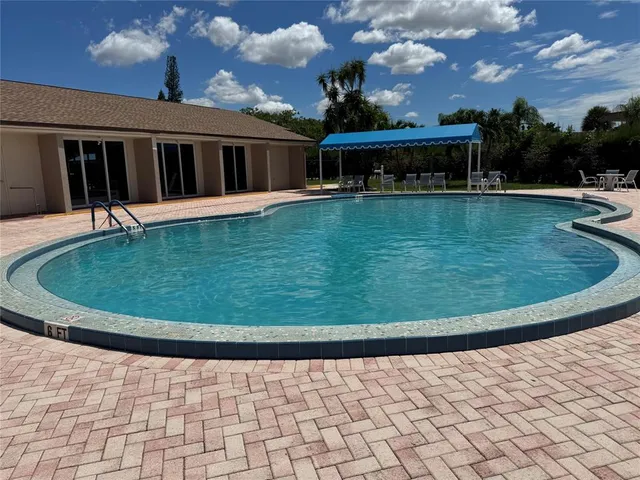 a view of swimming pool with a yard