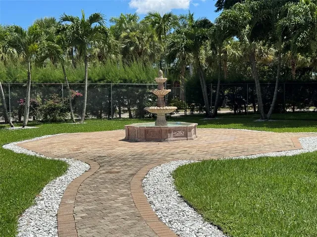 a view of a park with large trees