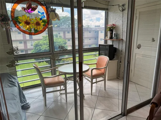 a view of a chairs and table in a room