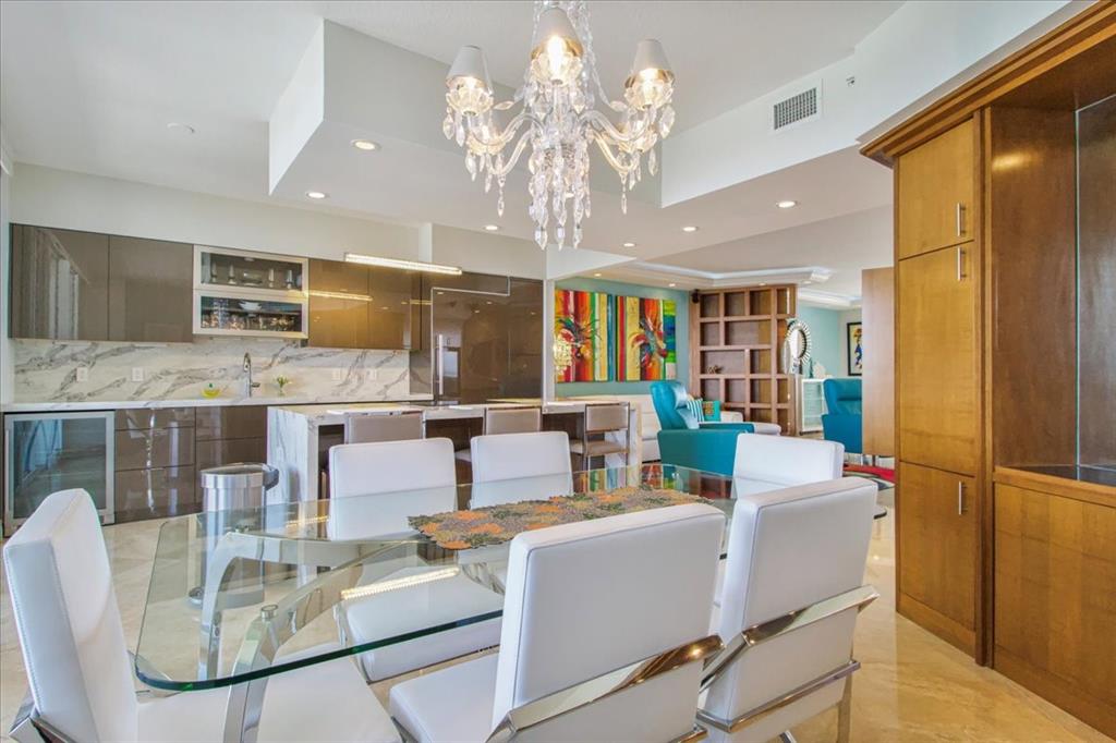 3100 North Ocean Boulevard, Unit 2103 Fort Lauderdale, FL 33308 - Photo 20 of 37 a living room with stainless steel appliances granite countertop furniture and a kitchen view