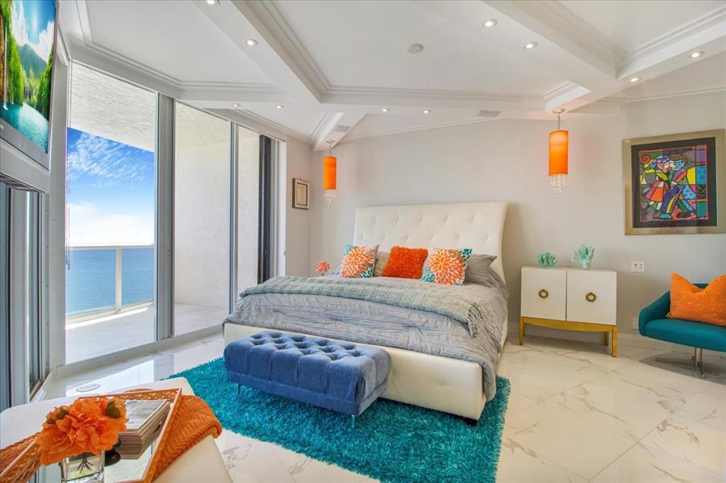 3100 North Ocean Boulevard, Unit 2103 Fort Lauderdale, FL 33308 - Photo 24 of 37 a bedroom with bed and window