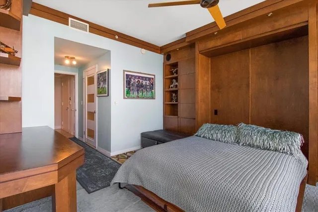 a bedroom with a bed and furniture