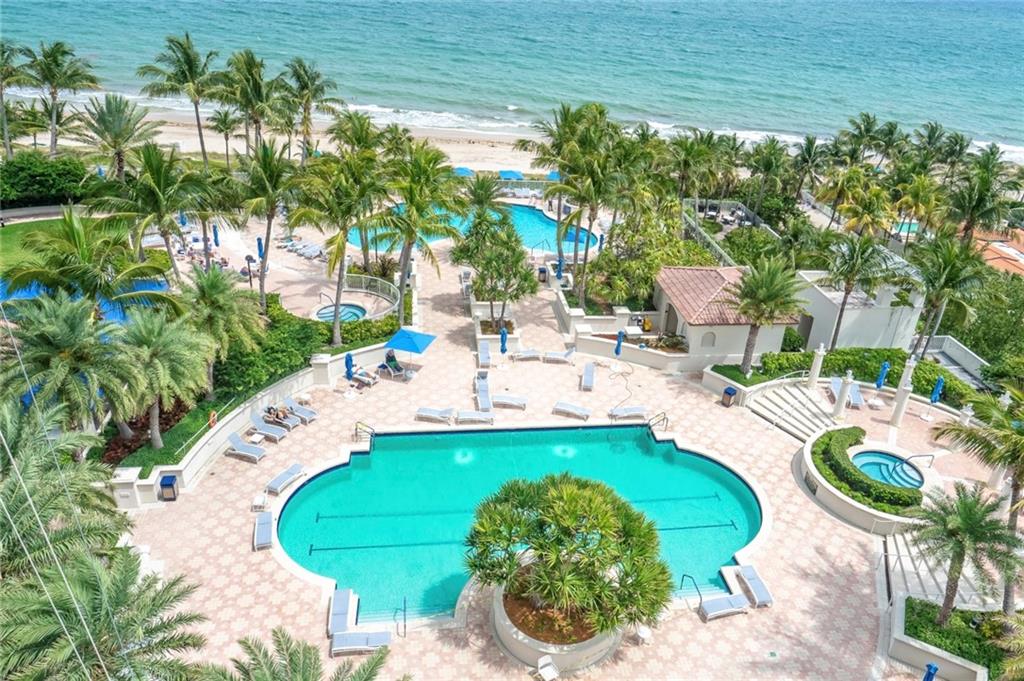 3100 North Ocean Boulevard, Unit 2103 Fort Lauderdale, FL 33308 - Photo 33 of 37 a view of a swimming pool with a patio