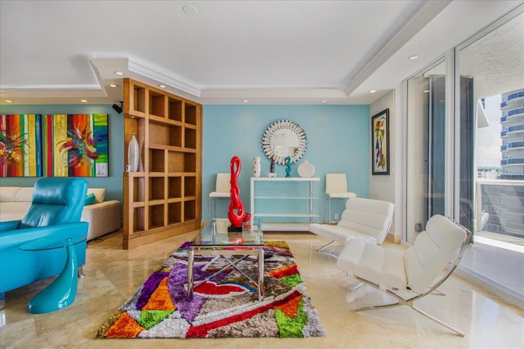3100 North Ocean Boulevard, Unit 2103 Fort Lauderdale, FL 33308 - Photo 5 of 37 a living room with patio furniture and a rug