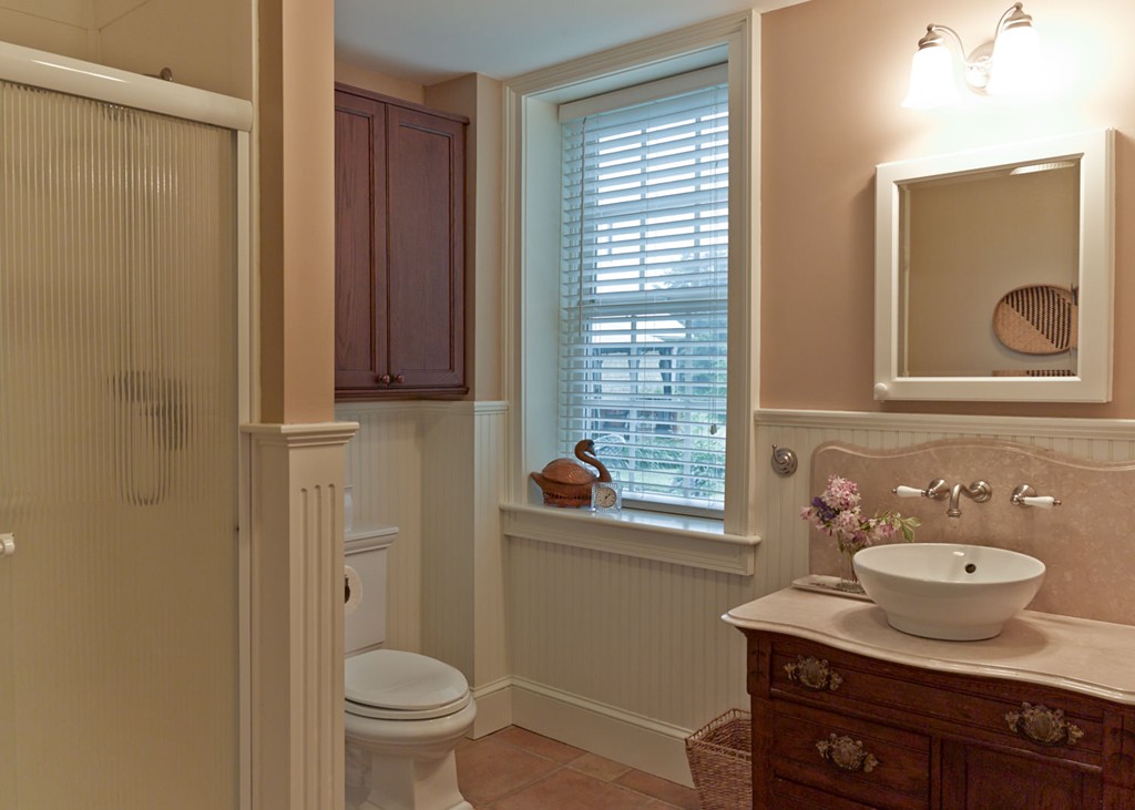 199 Huntington Road Worthington, MA 01098 - Photo 21 of 30 a bathroom with a granite countertop sink toilet and mirror