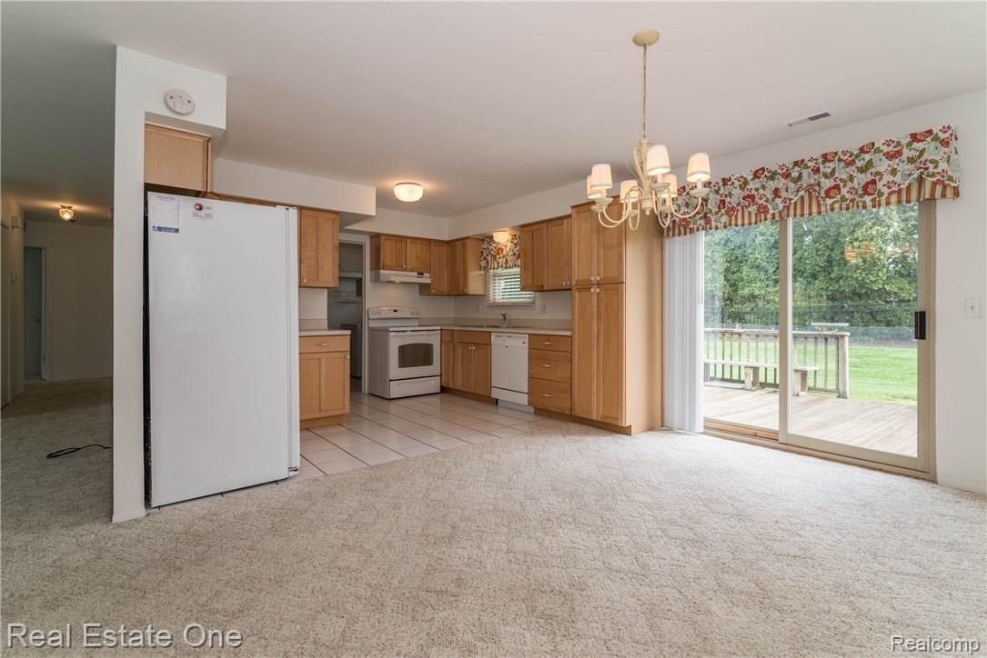 612 Ridge Road Walled Lake, MI 48390 - Photo 11 of 25 Impeccably clean with nice entrance on to back deck