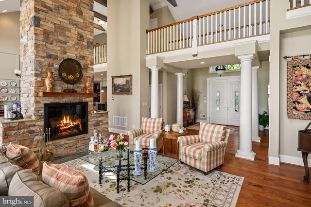 a bedroom with a bed and glass walk in closet