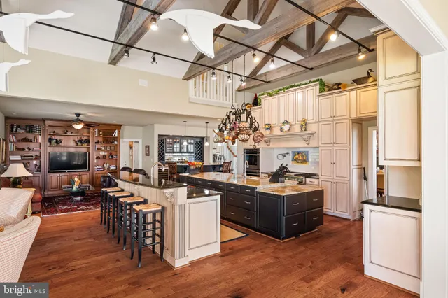 a kitchen with granite countertop a sink and a window