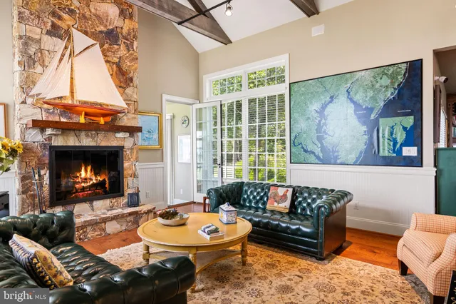 a bedroom with a bed a couch and a window