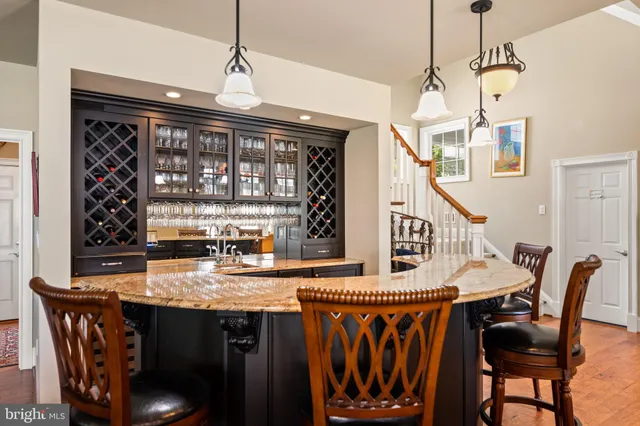 a front view of a house with a yard and trees