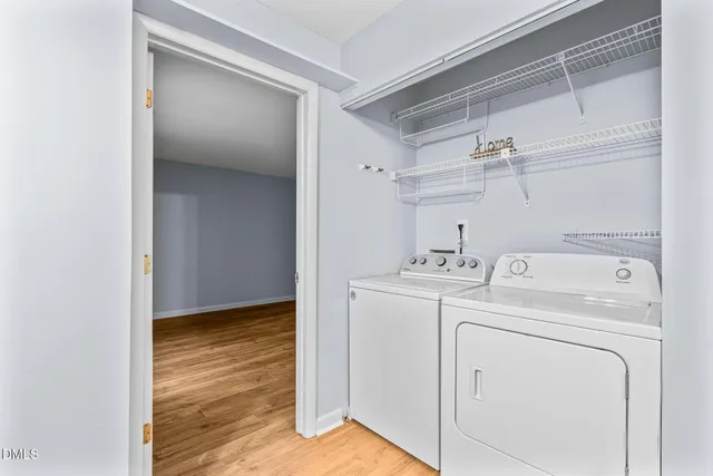 a view of storage and utility room with washer and dryer