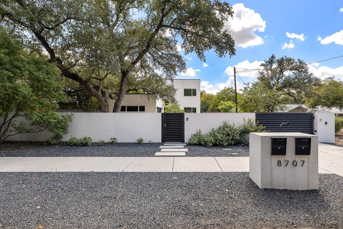 8707 Leo Street Austin, TX 78745 - Photo 1 of 1 a view of a back yard of the house