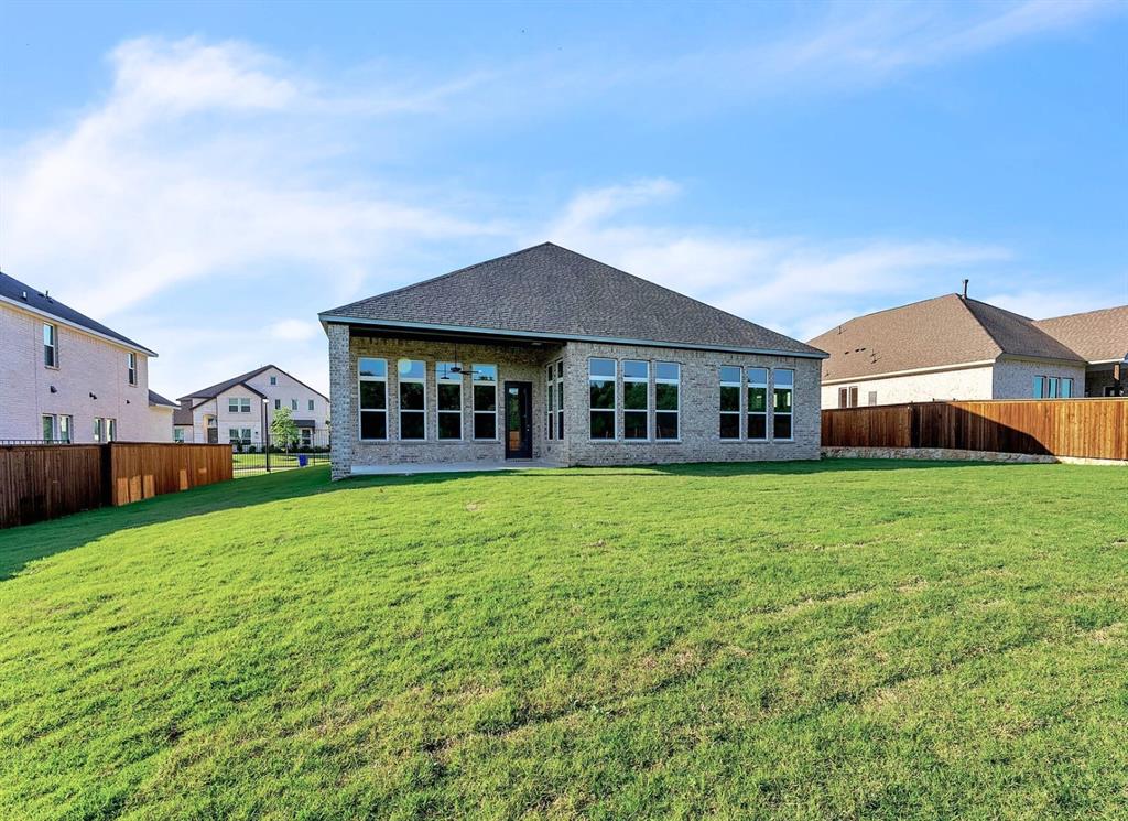 1215 Olive Drive Mansfield, TX 76063 - Photo 24 of 28 a front view of a house with a garden