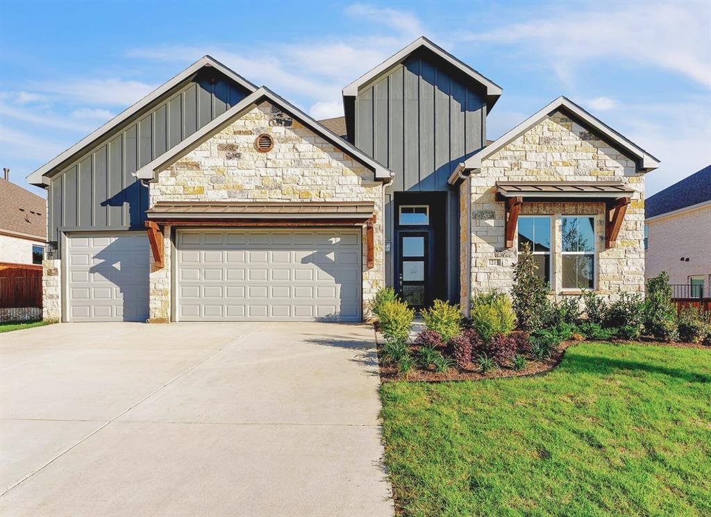 1215 Olive Drive Mansfield, TX 76063 - Photo 3 of 28 a front view of a house with garden