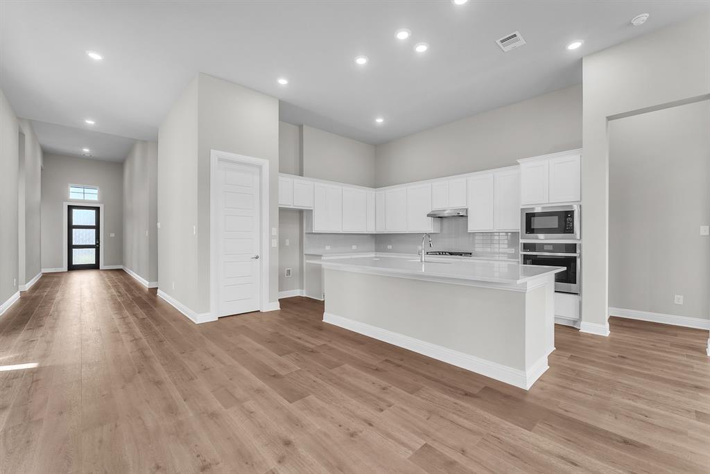 1215 Olive Drive Mansfield, TX 76063 - Photo 10 of 28 a view of kitchen with sink microwave and stove