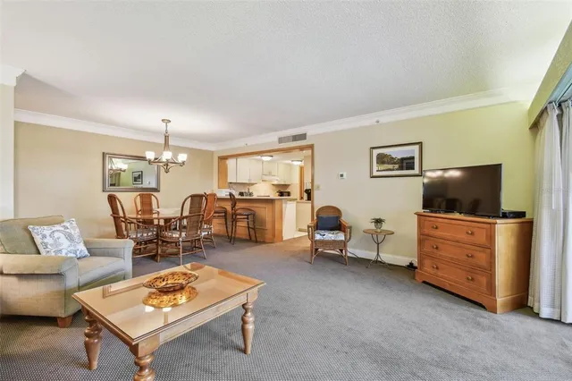 a view of a room with a large window and chair