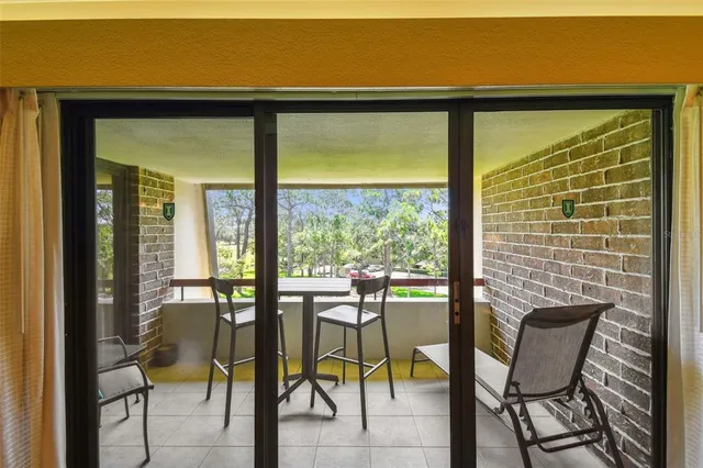 a kitchen with a table chairs and a refrigerator
