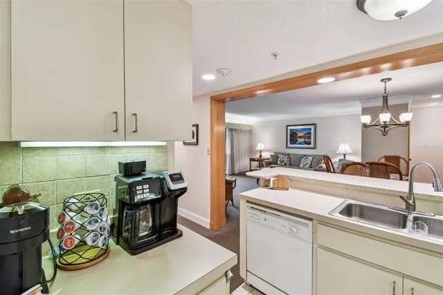 a bathroom with a granite countertop sink toilet and a mirror