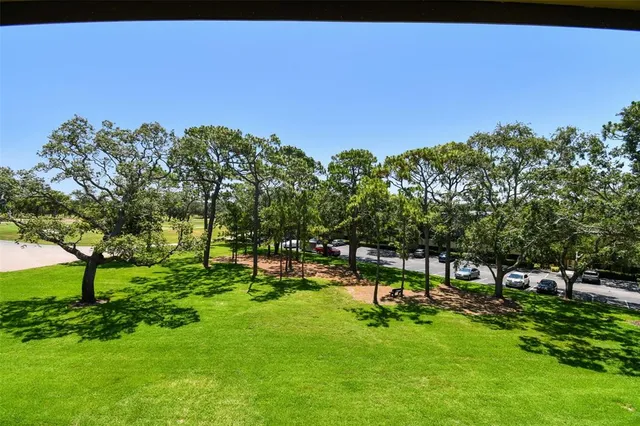 a view of a chairs and table in the patio