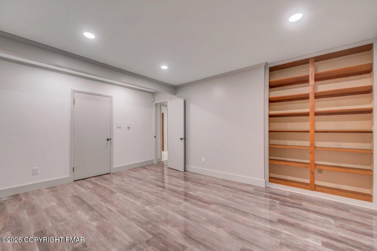 384 Devils Hole Road Cresco, PA 18326 - Photo 68 of 97 a view of an empty room with a wooden floor and a window