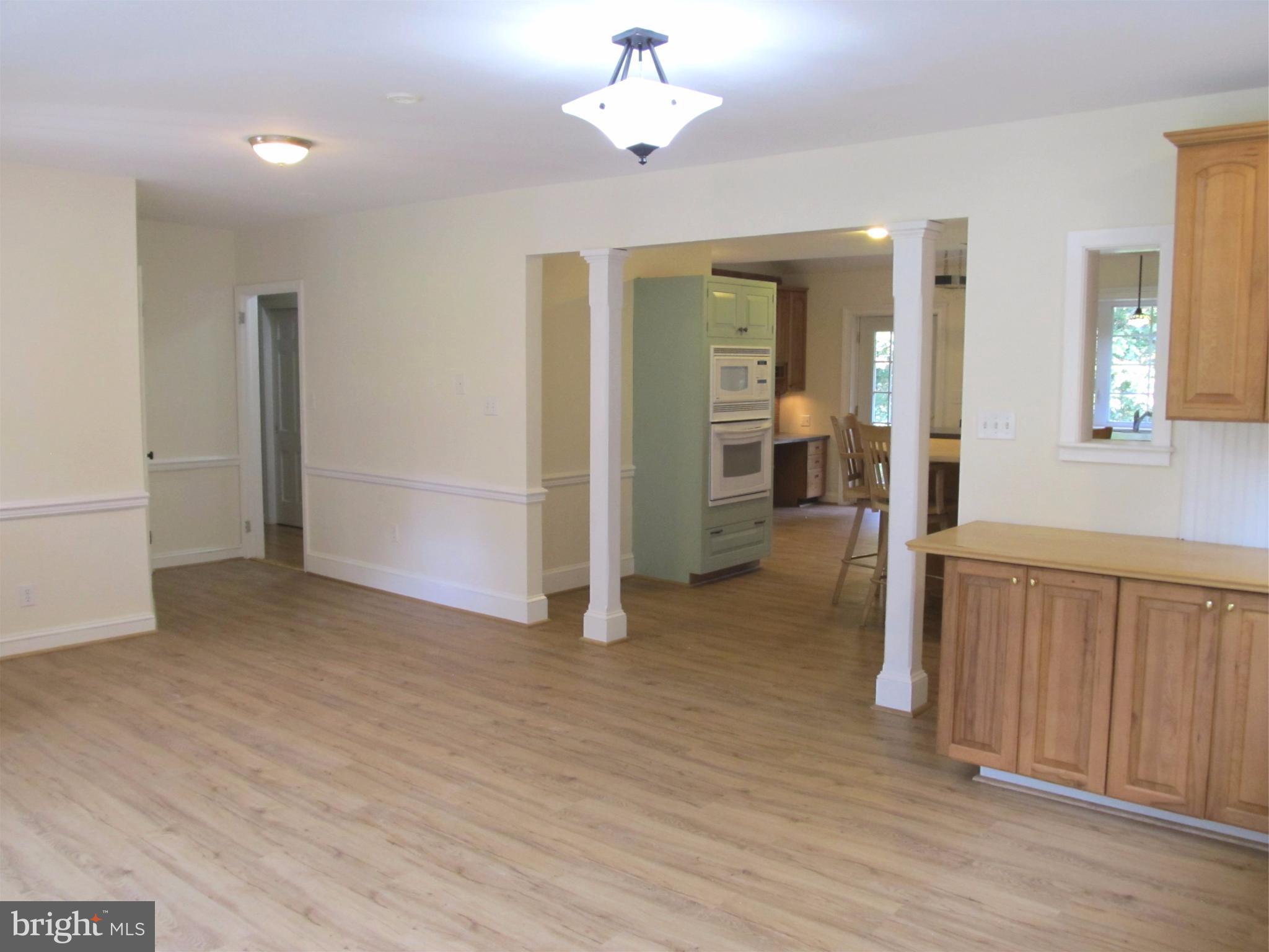5679 Senseny Road Berryville, VA 22611 - Photo 6 of 30 The front living room opens to the kitchen.