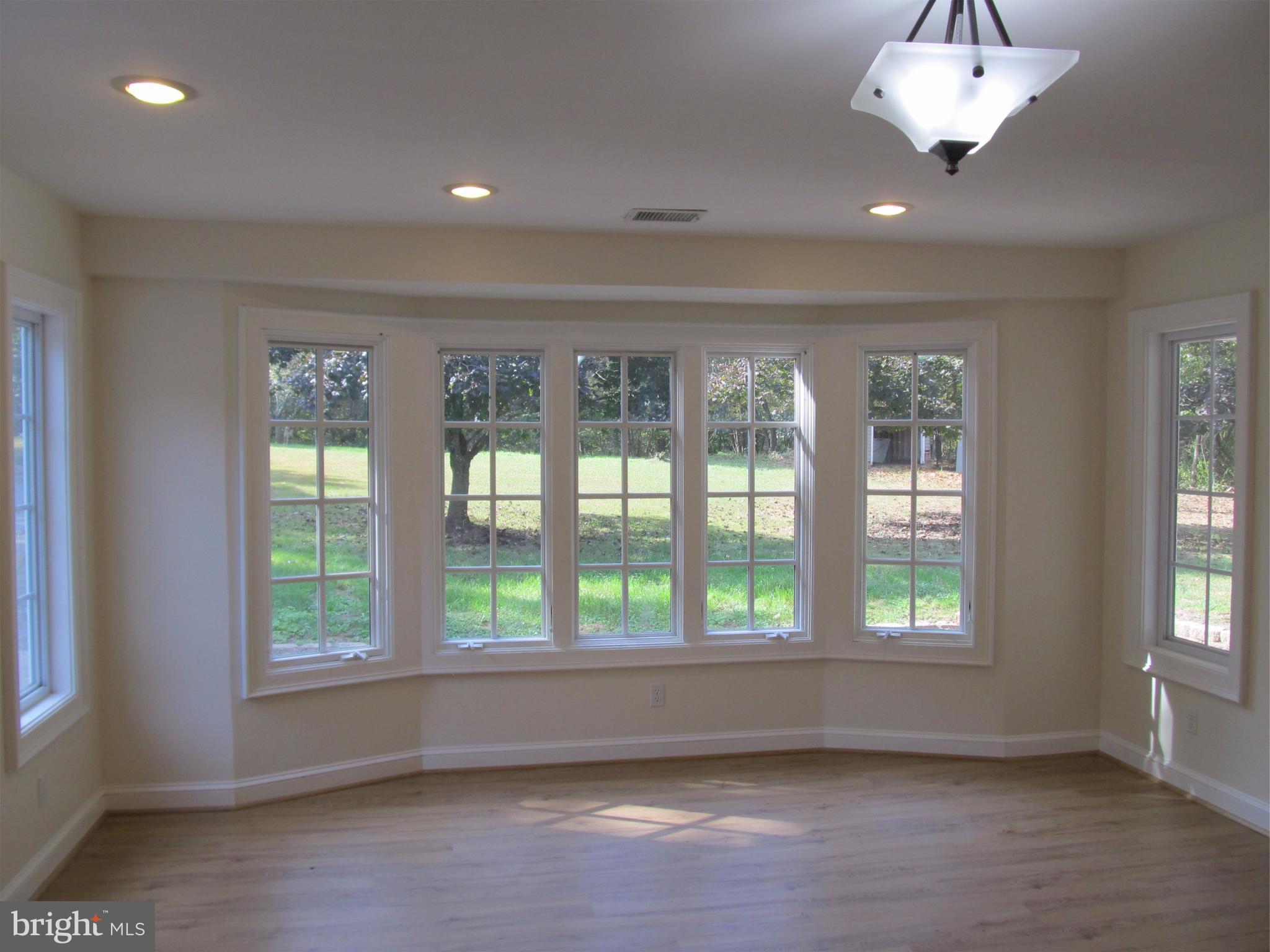 5679 Senseny Road Berryville, VA 22611 - Photo 7 of 30 Bay windows overlook the private front yard.