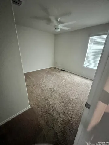 a view of a storage & utility room with a sink