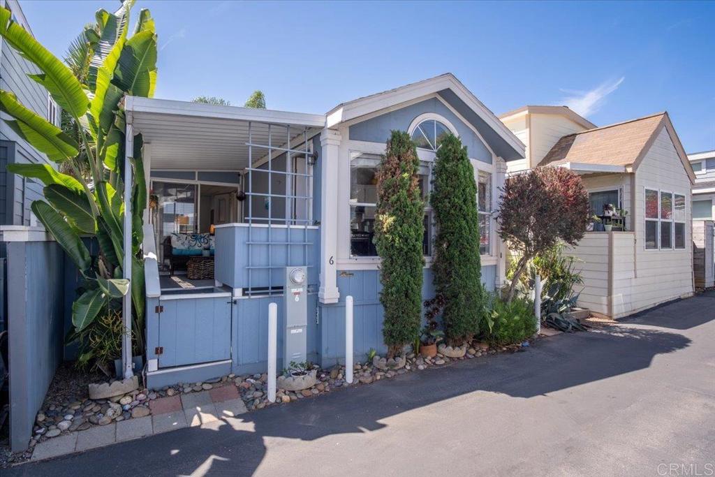 1624 North Coast Highway 101, Unit 6 Encinitas, CA 92024 - Photo 2 of 26 a front view of a house with garden