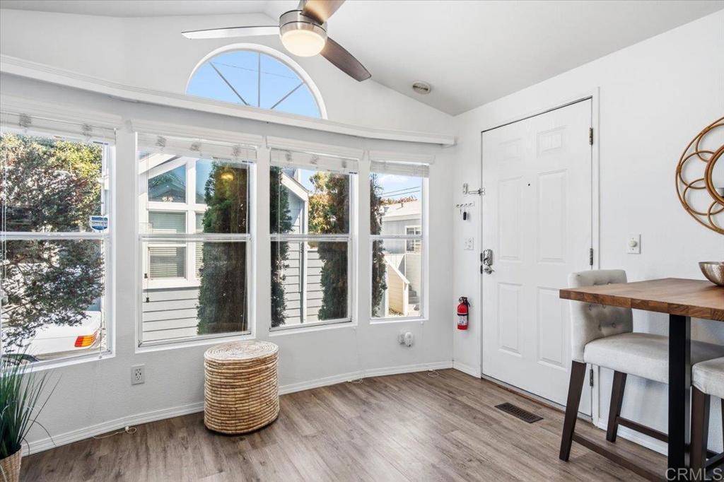 1624 North Coast Highway 101, Unit 6 Encinitas, CA 92024 - Photo 7 of 26 a view of empty room with wooden floor and fan