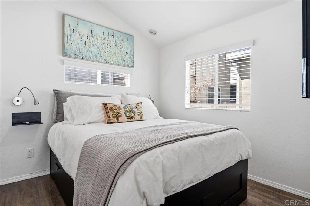 1624 North Coast Highway 101, Unit 6 Encinitas, CA 92024 - Photo 9 of 26 a bedroom with a bed and a window