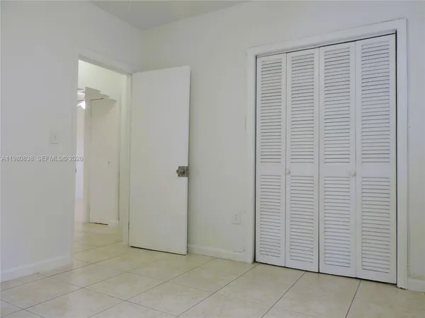 a bathroom with a sink a toilet a mirror and a bathtub