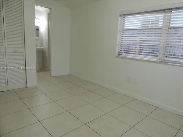 an empty room with a bathroom