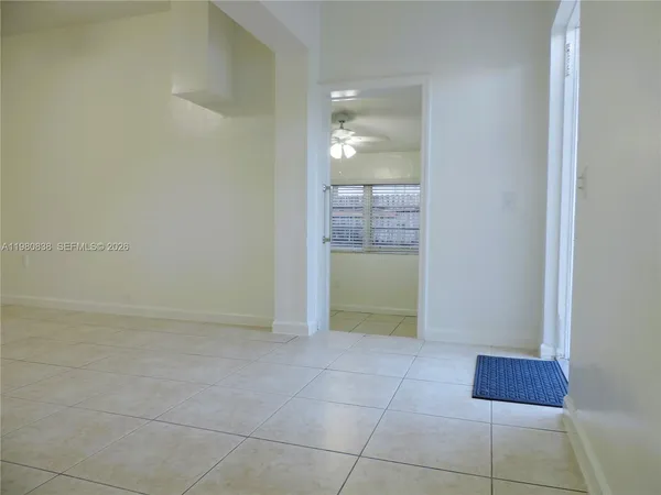 a white toilet sitting next to a white sink
