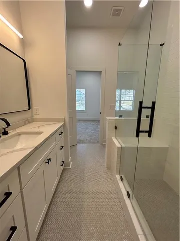 a view of a room with wooden floor and furniture