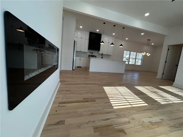 a view of kitchen with furniture and flat screen tv