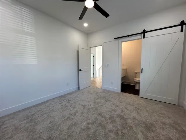 a view of balcony with wooden floor and fence