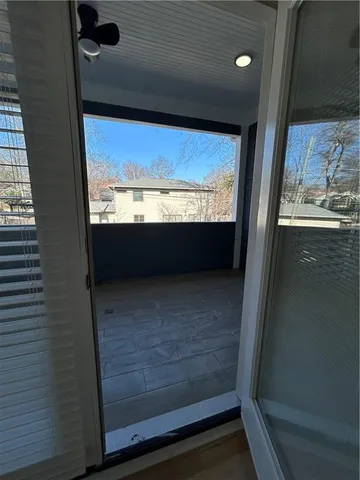 a bathroom with a toilet a sink a mirror and bathtub