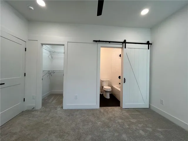 a view of livingroom with hardwood floor and a ceiling fan
