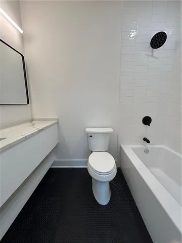a white bath tub sitting in a bathroom
