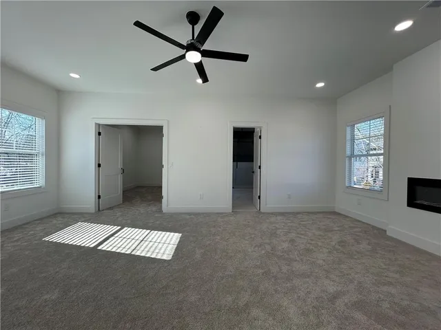 a bathroom with a glass shower door