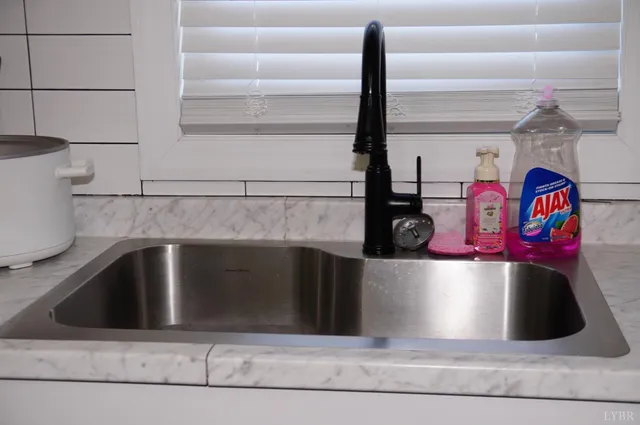 a kitchen with a sink and a refrigerator