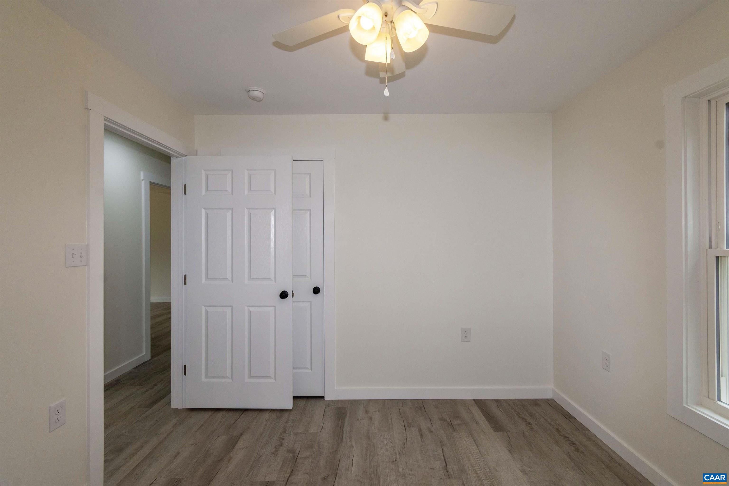 15301 Shirley Road Unionville, VA 22567 - Photo 14 of 27 wooden floor in an empty room with a window