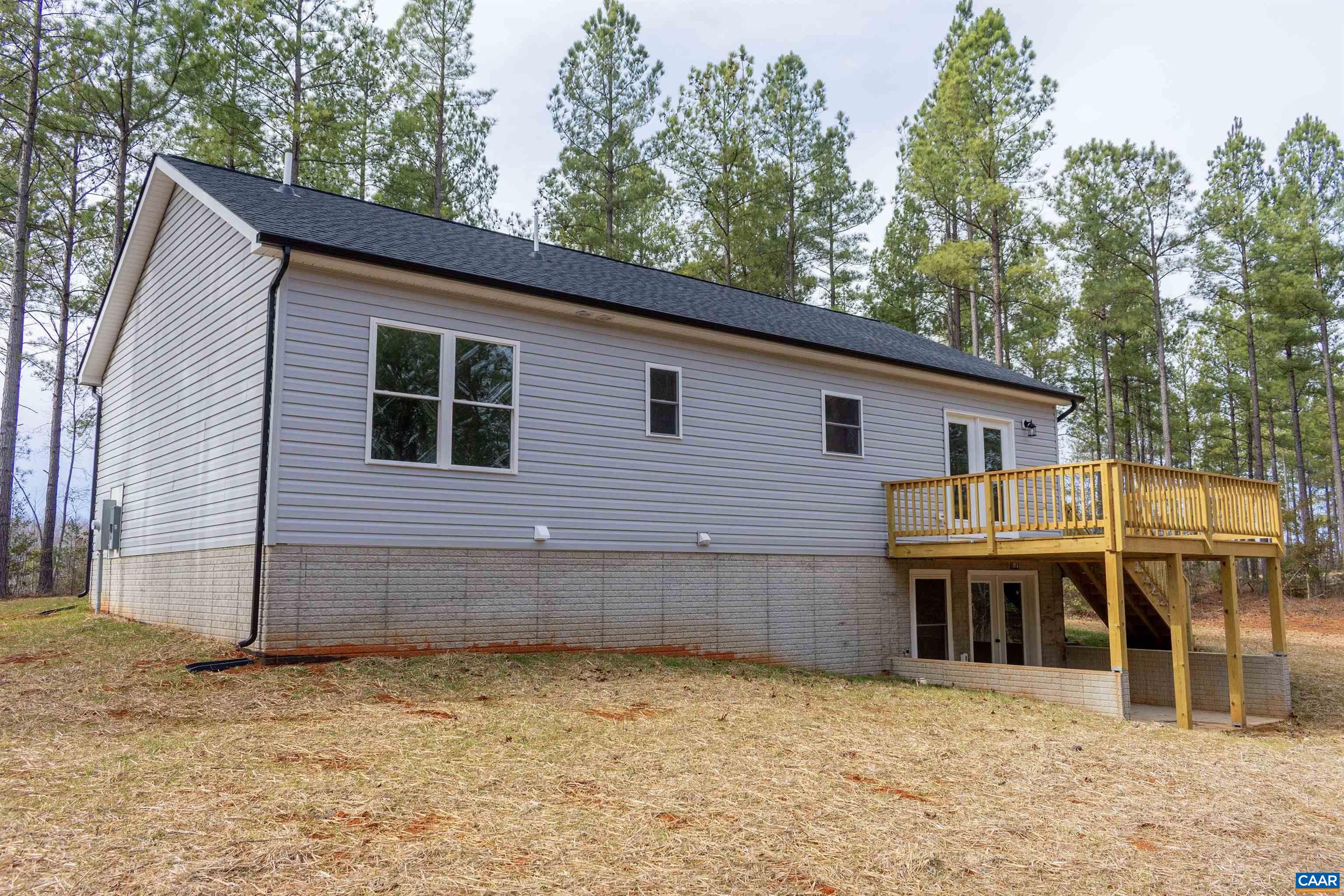 15301 Shirley Road Unionville, VA 22567 - Photo 23 of 27 a backyard of a house with table and chairs