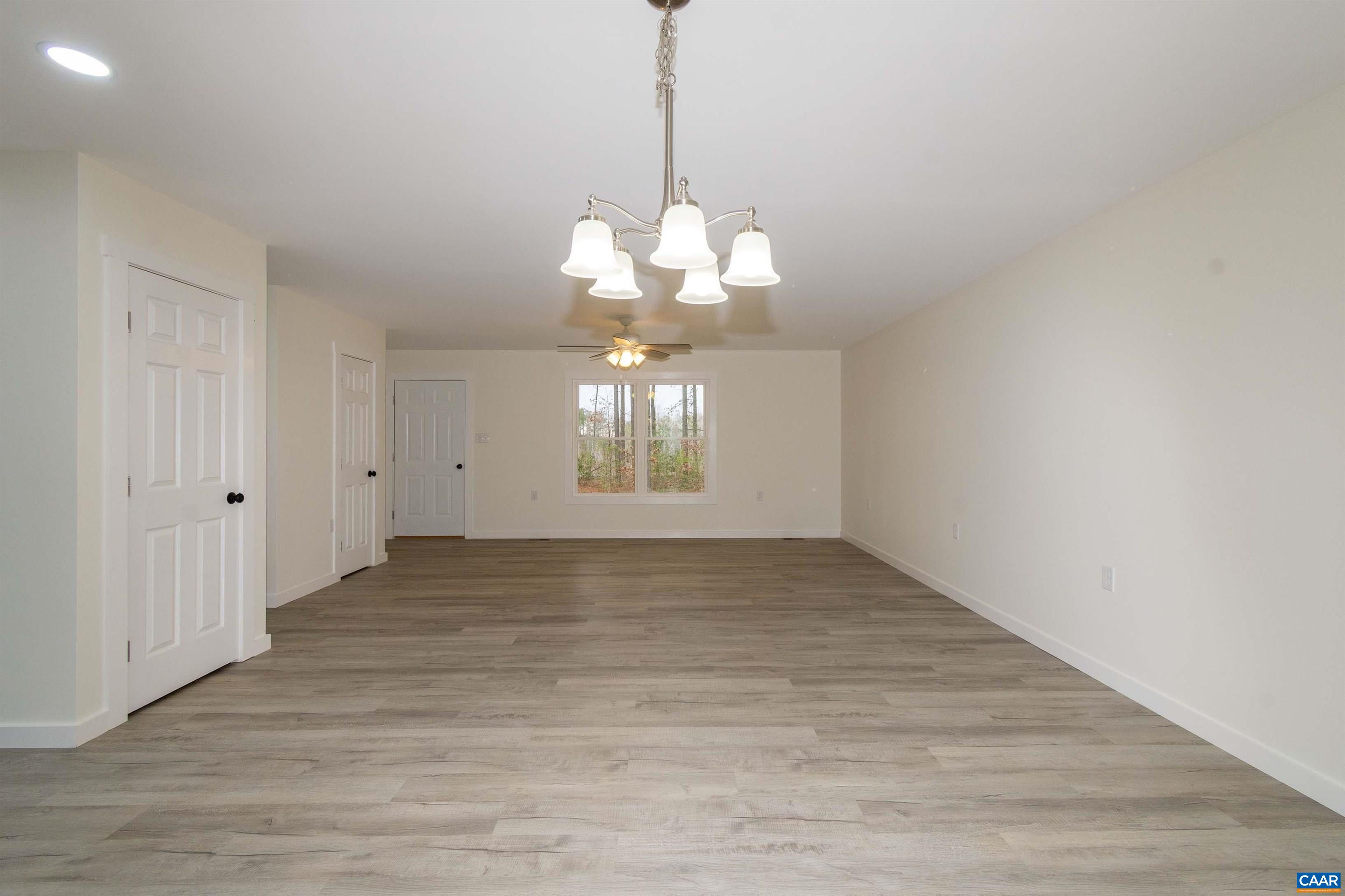 15301 Shirley Road Unionville, VA 22567 - Photo 4 of 27 a view of an empty room with wooden floor and a window