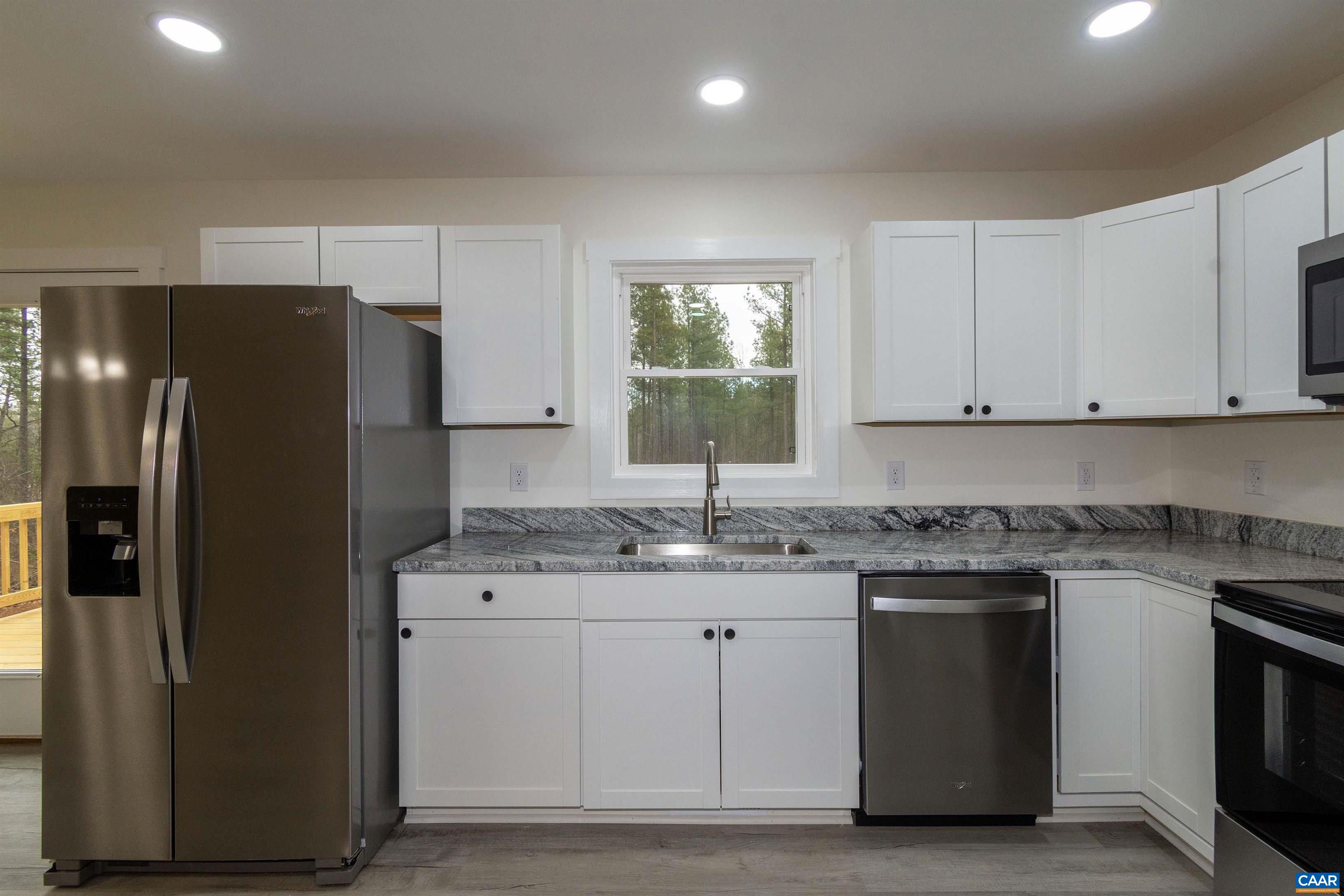 15301 Shirley Road Unionville, VA 22567 - Photo 8 of 27 a kitchen with a sink stove and refrigerator