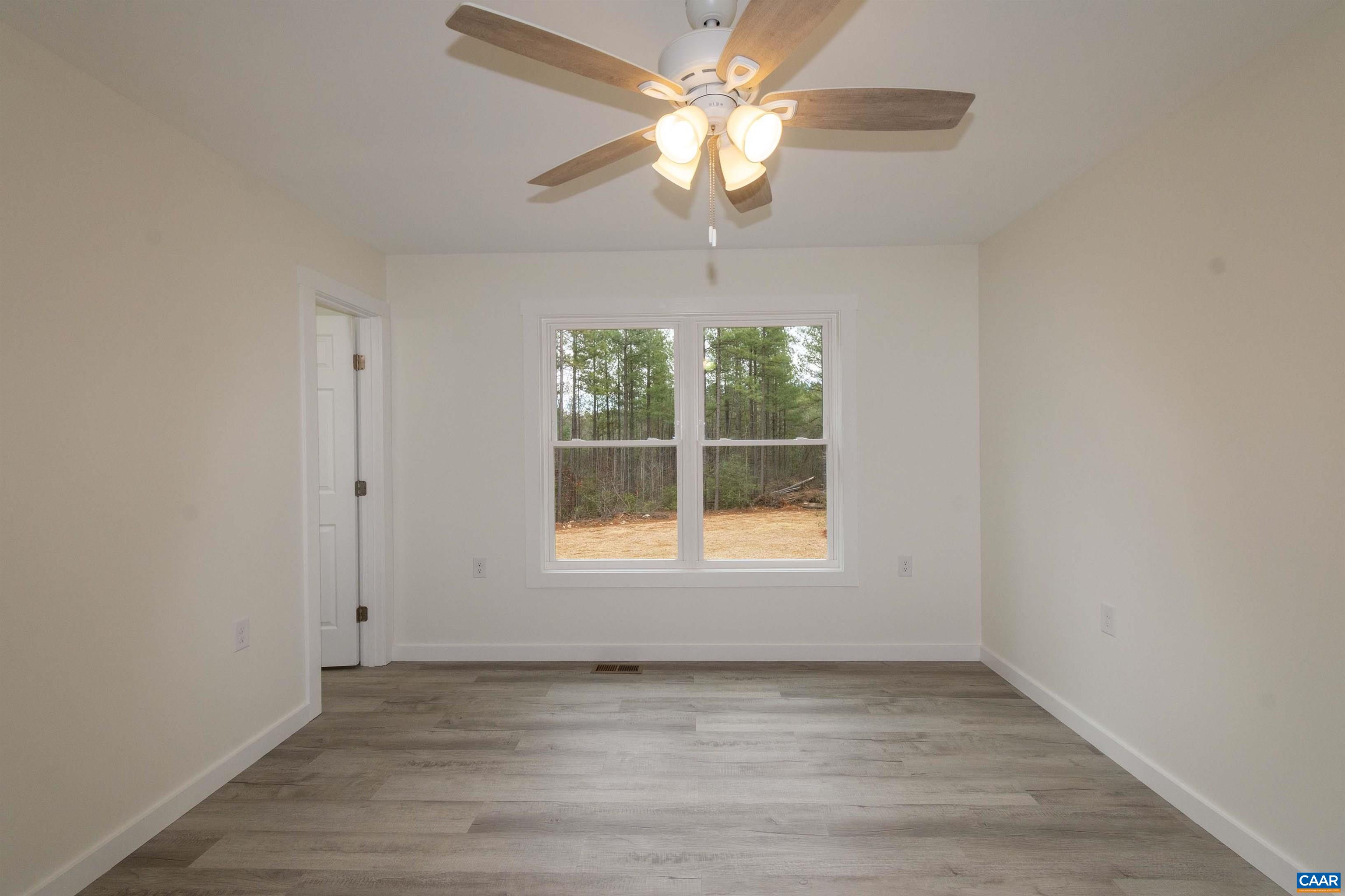 15301 Shirley Road Unionville, VA 22567 - Photo 10 of 27 an empty room with a window and a fan